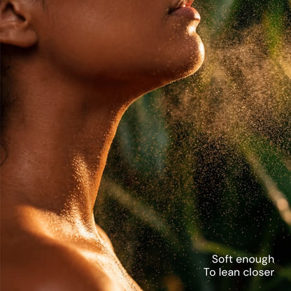  woman applying citta pink dusk skin scent body mist for a fresh everyday fragrance