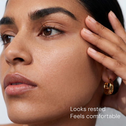  Woman with brighter-looking eyes after using peptide under eye cream for dark circles