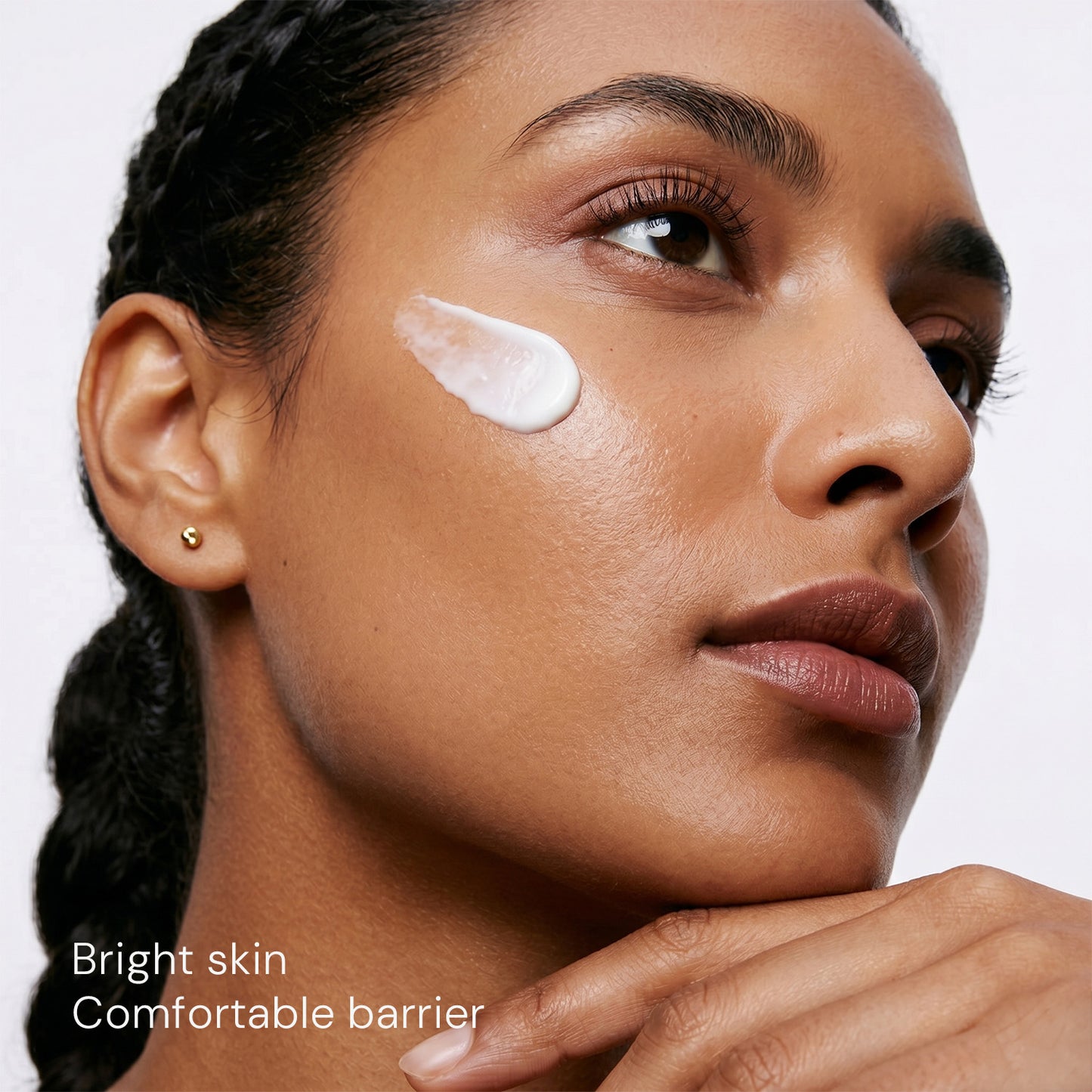 Woman with brighter-looking skin after using antioxidant moisturizer for dull skin
