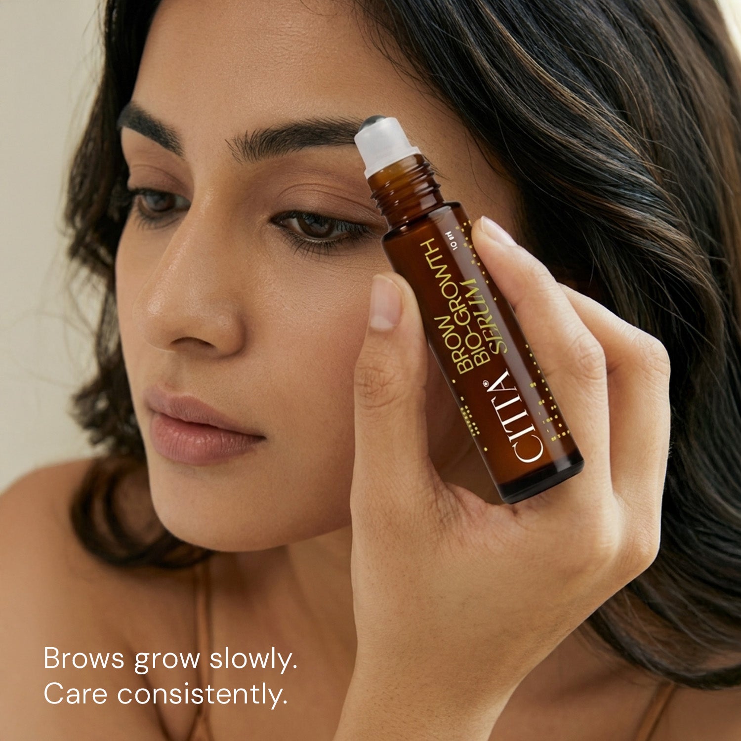 Woman applying CITTA eyebrow growth serum for healthier-looking brows